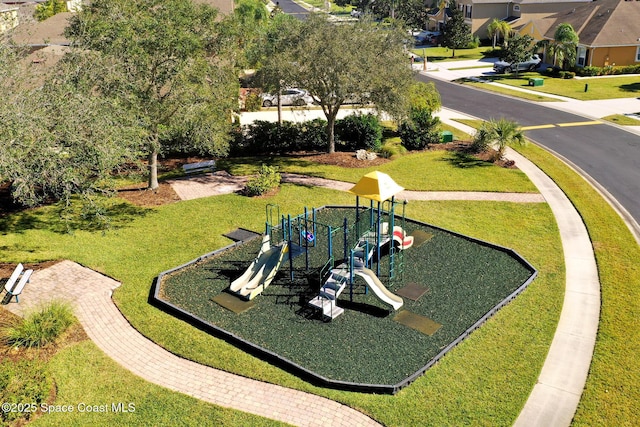 view of community with a lawn and a playground