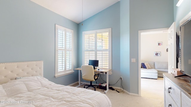 bedroom featuring light carpet and vaulted ceiling