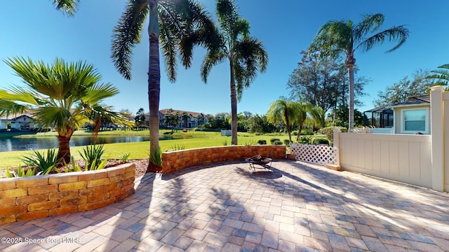 view of patio with a water view