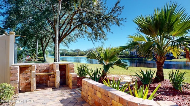 view of patio with a water view