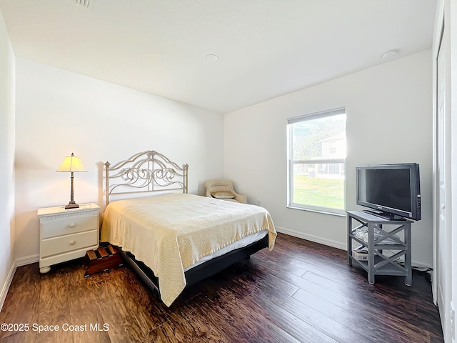 bedroom featuring dark hardwood / wood-style floors