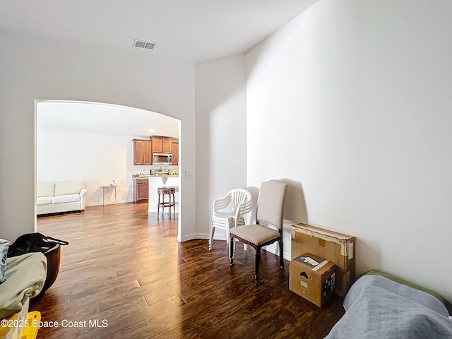 living area with dark hardwood / wood-style floors