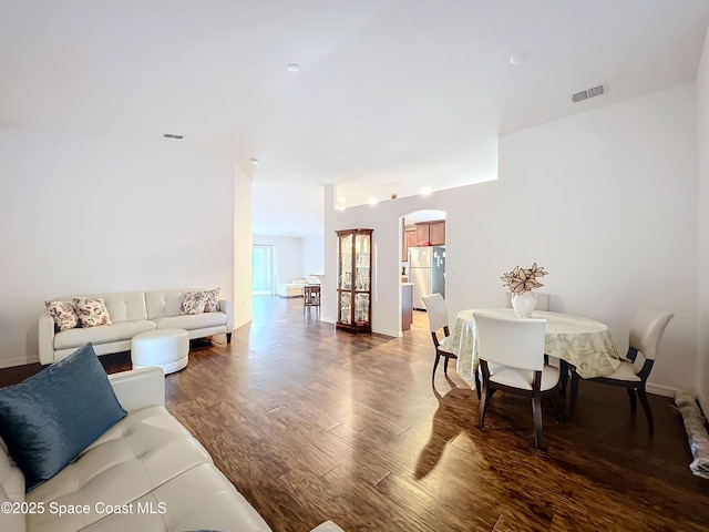 living room featuring dark wood-type flooring