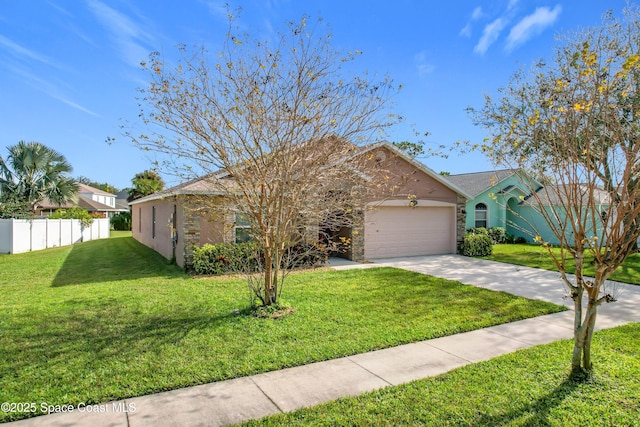 view of front of house featuring a front yard and a garage