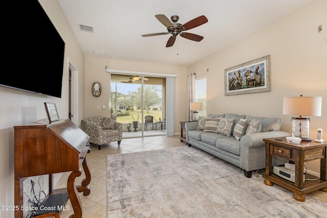 living room with light tile patterned floors and ceiling fan