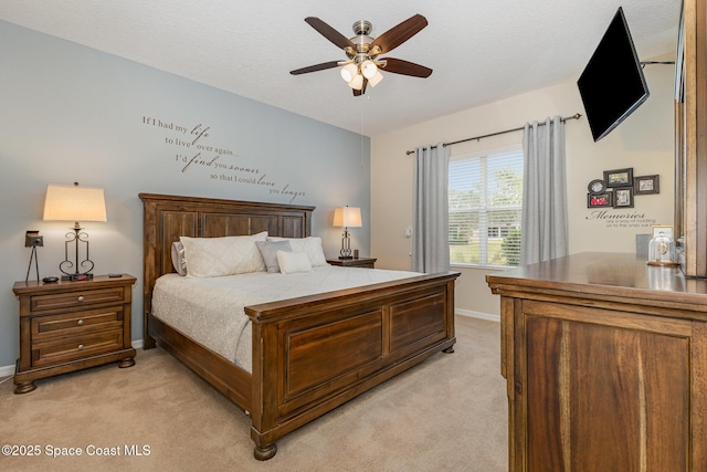 bedroom featuring ceiling fan and light colored carpet