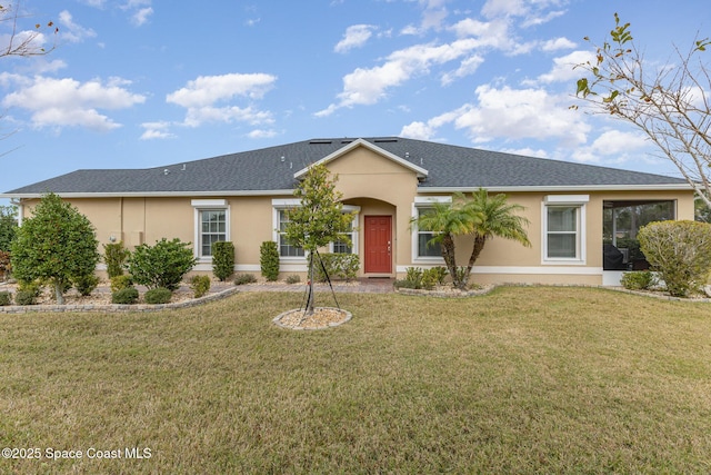 ranch-style house featuring a front lawn