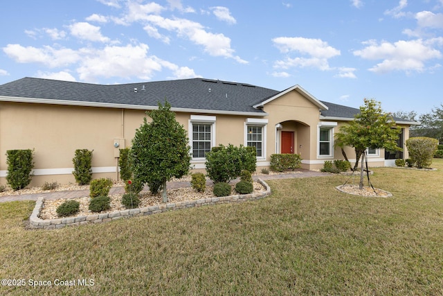 single story home featuring a front lawn