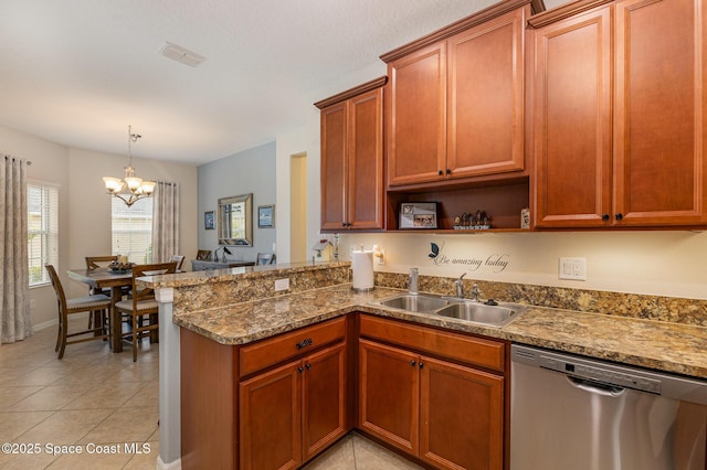 kitchen with kitchen peninsula, stainless steel dishwasher, sink, light tile patterned floors, and an inviting chandelier