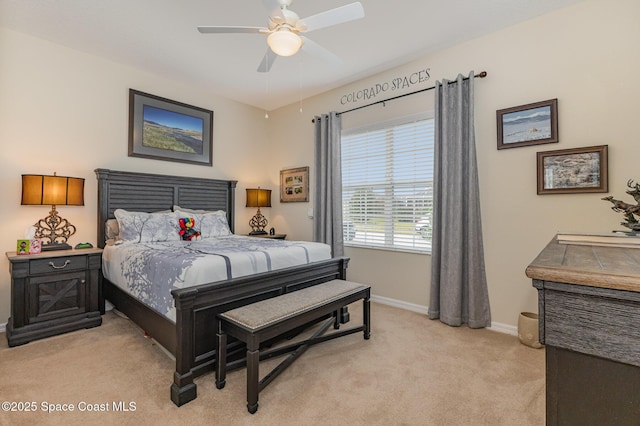 bedroom with ceiling fan and light carpet