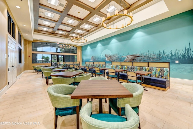 interior space with a high ceiling, an inviting chandelier, coffered ceiling, light tile patterned floors, and beam ceiling