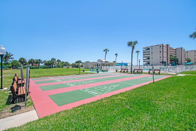 view of home's community with a yard