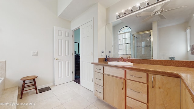 bathroom featuring tile patterned flooring, vanity, an enclosed shower, and ceiling fan