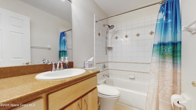 full bathroom featuring vanity, shower / bath combo, and toilet