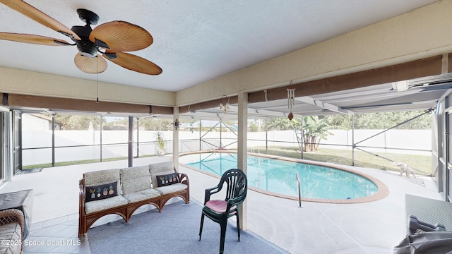 view of swimming pool featuring ceiling fan