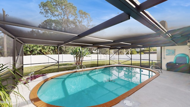 view of swimming pool with a lawn and a patio area