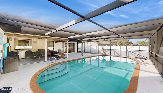 view of swimming pool with a lanai and a patio