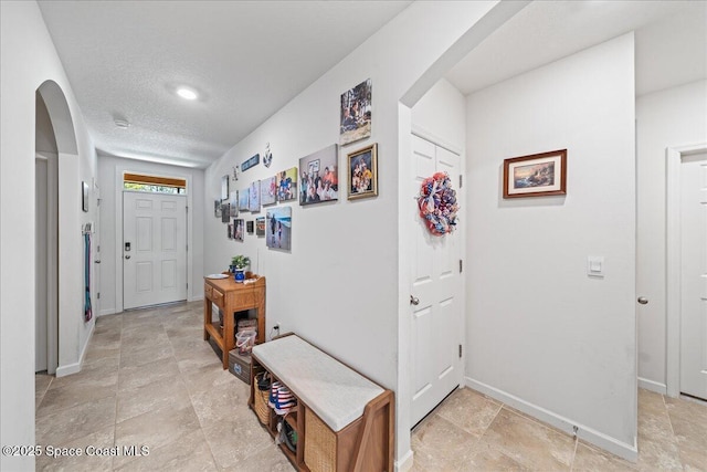 entrance foyer with a textured ceiling