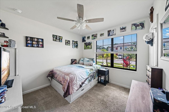 carpeted bedroom with ceiling fan