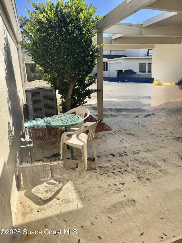 view of patio with central AC unit