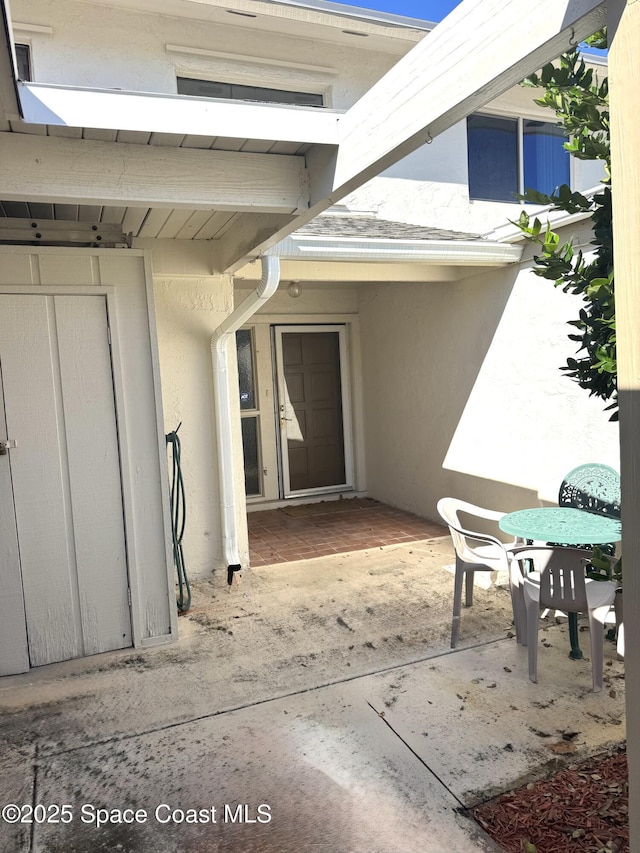 doorway to property featuring a patio