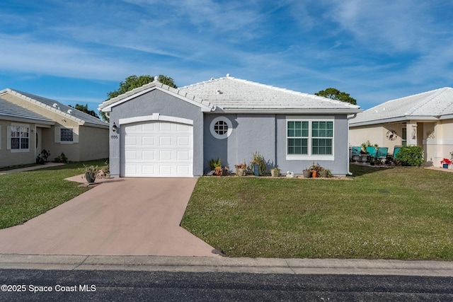 ranch-style home with a front yard and a garage