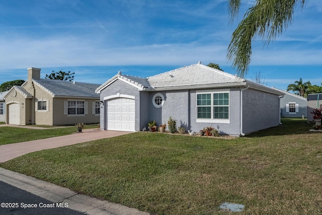 ranch-style home with a front lawn and a garage