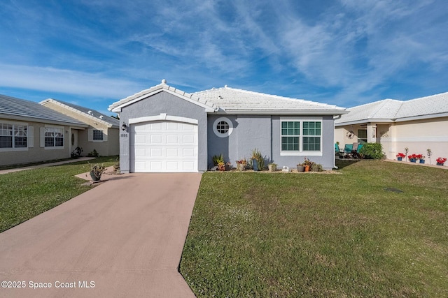 ranch-style house featuring a garage and a front yard