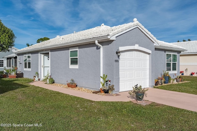 ranch-style home featuring a front yard and a garage