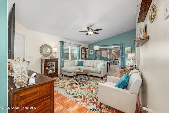 tiled living room with ceiling fan and lofted ceiling