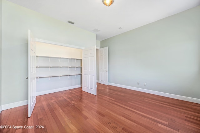 unfurnished bedroom with wood-type flooring