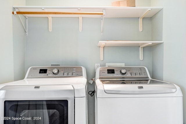 washroom with independent washer and dryer