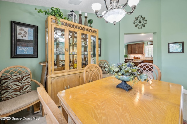 dining space with a notable chandelier