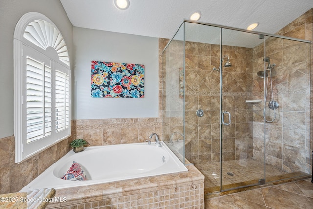 bathroom with a textured ceiling and plus walk in shower