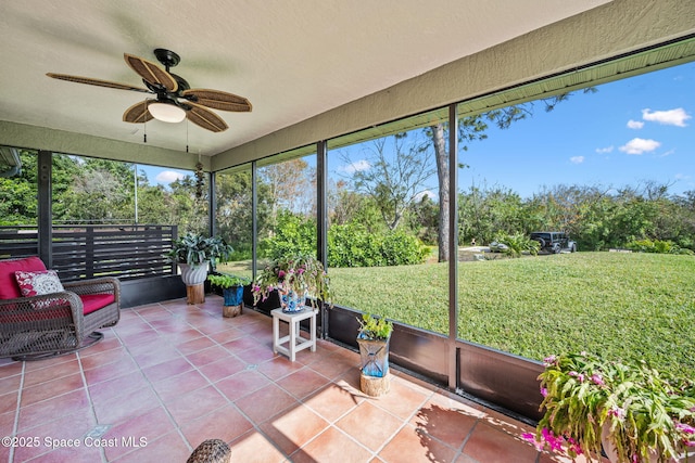 sunroom featuring ceiling fan