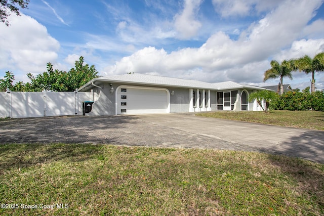 view of front facade featuring a garage and a front lawn