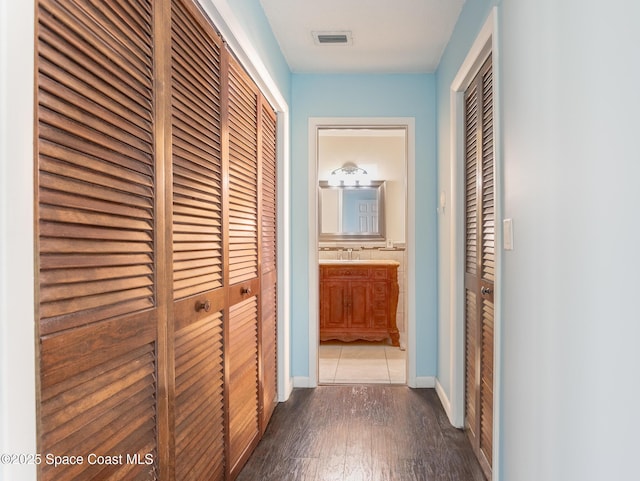 hallway featuring wood-type flooring