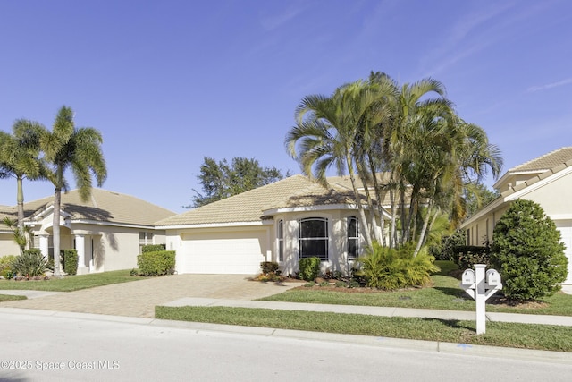 view of front of property with a garage