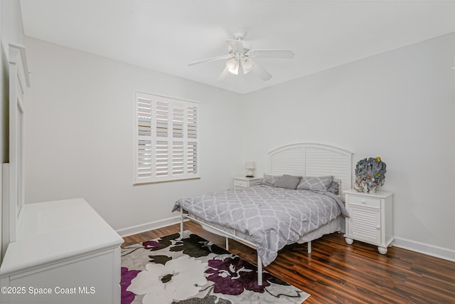 bedroom featuring ceiling fan and dark hardwood / wood-style floors