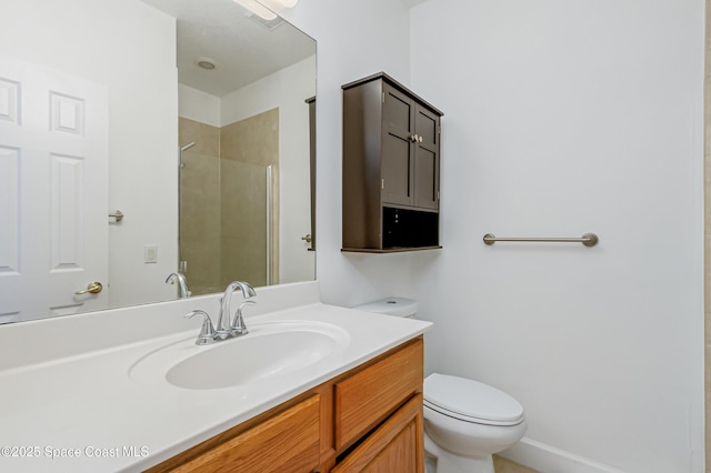 bathroom with vanity, toilet, and a shower with door