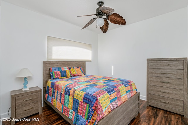 bedroom featuring ceiling fan and dark wood-type flooring