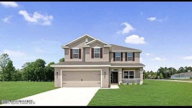 view of front of home with a front yard and a garage