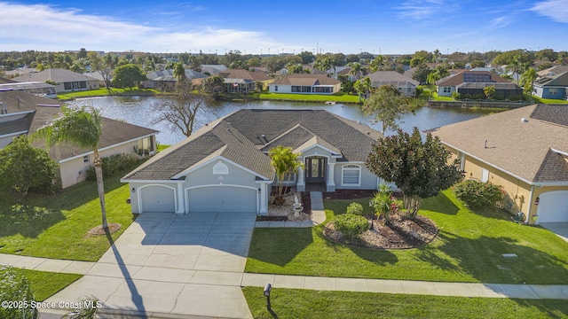 birds eye view of property featuring a water view