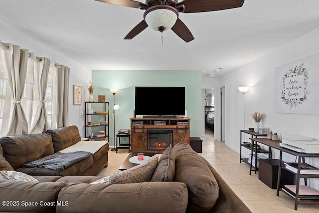 tiled living room featuring ceiling fan