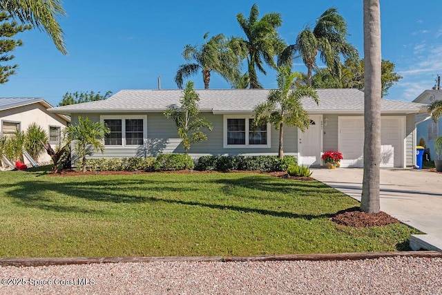 single story home featuring a front lawn and a garage