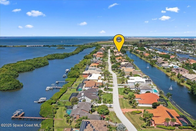 aerial view with a water view and a residential view