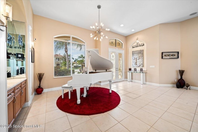 misc room with a chandelier and light tile patterned floors