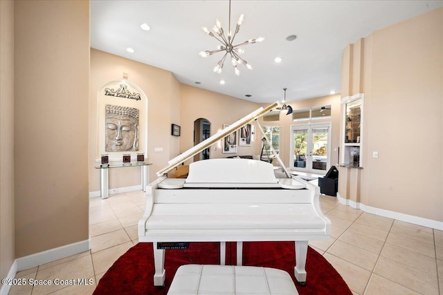 miscellaneous room with french doors, light tile patterned flooring, and a notable chandelier