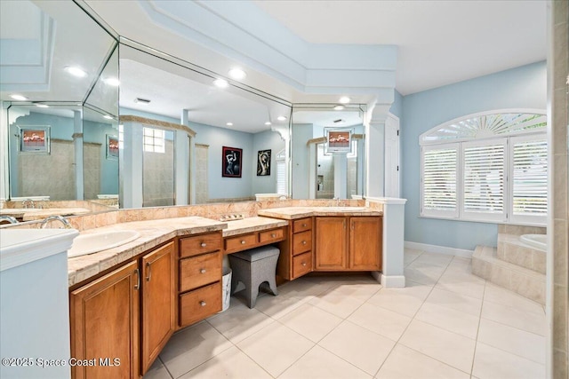 bathroom with tile patterned floors, vanity, and independent shower and bath