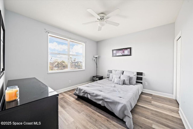 bedroom featuring ceiling fan and light hardwood / wood-style flooring